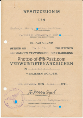 Besitzzeugnis Verwundetenabzeichen in Schwarz für einen Waffen SS Oberscharführer im Waffen SS Grenadier Regiment 31 Ausgestellt 1945 - 31. SS-Freiwilligen-Grenadier-Division